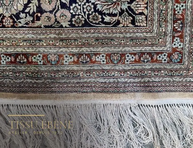 Frange de tapis stabilisée par un point d&rsquo;arrêt, extrémité nette et régulière